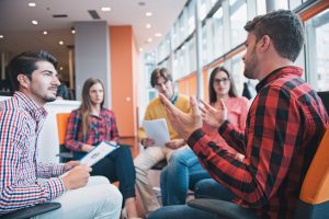 stock image of a meeting between a group of people