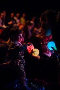 child in audience watching Kaleidoscope. show image