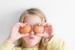 stock IMAGE OF CHILD HOLDING EGGS