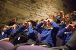 Children watching theatre as part of TakeOff Festival