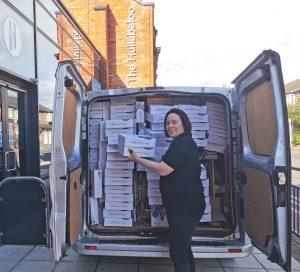 Theatre Hullabaloo's Production Manager loading the van with Baby Play Packs