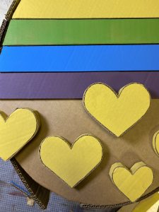 yellow hearts on an cardboard egg shape