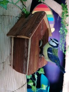 Felt bird on a bird box