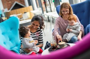 Families drinking coffee at The Hullabaloo