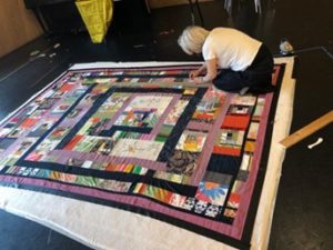 A person working on a quilt (Photo credit: Jess Jones)